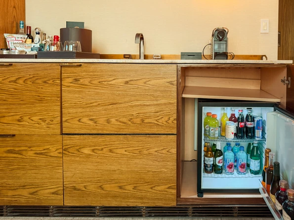 Open mini fridge with drinks inside at The Dominick.