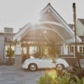 A vintage car in front of the entrance to L'Auberge Del Mar