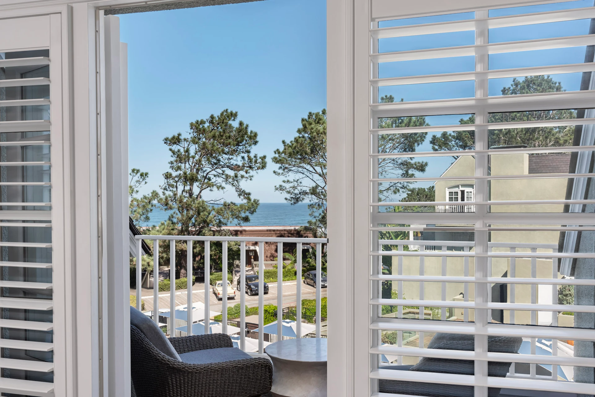 Ocean view through plantation shutters from the Coastal King room.