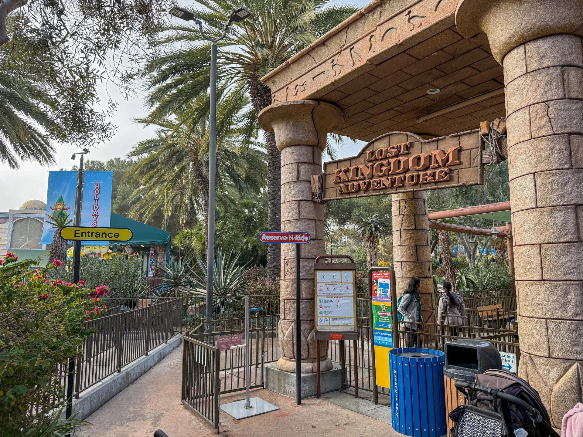 An old Reserve N Ride sign in front of Lost Kingdom Adventure at LEGOLAND California.