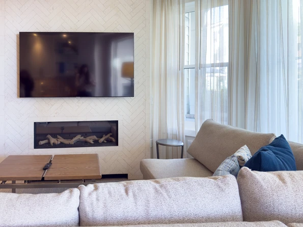 Villa living room with fireplace at Shore House at The Del.
