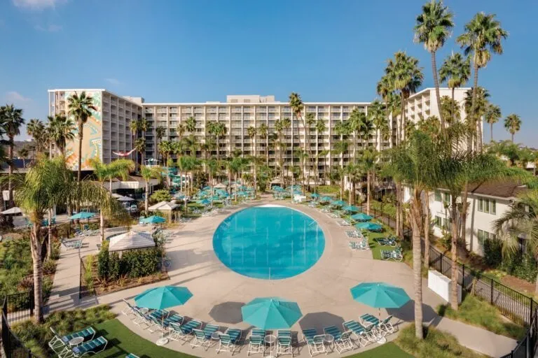Town and Country Resort in San Diego view over pool to building.