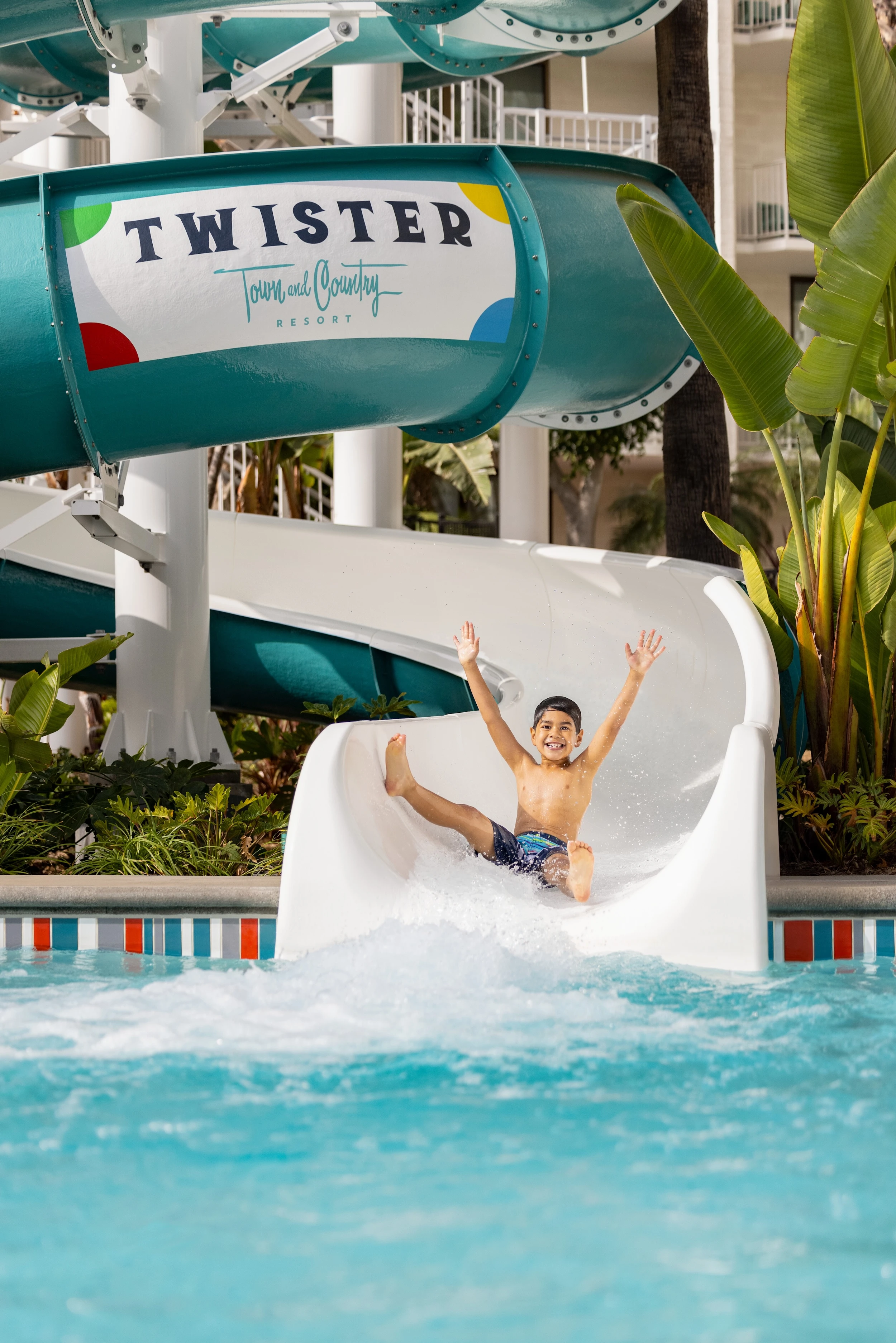 A child rides down the Twister waterslide at Town and Country Resort in San Diego.