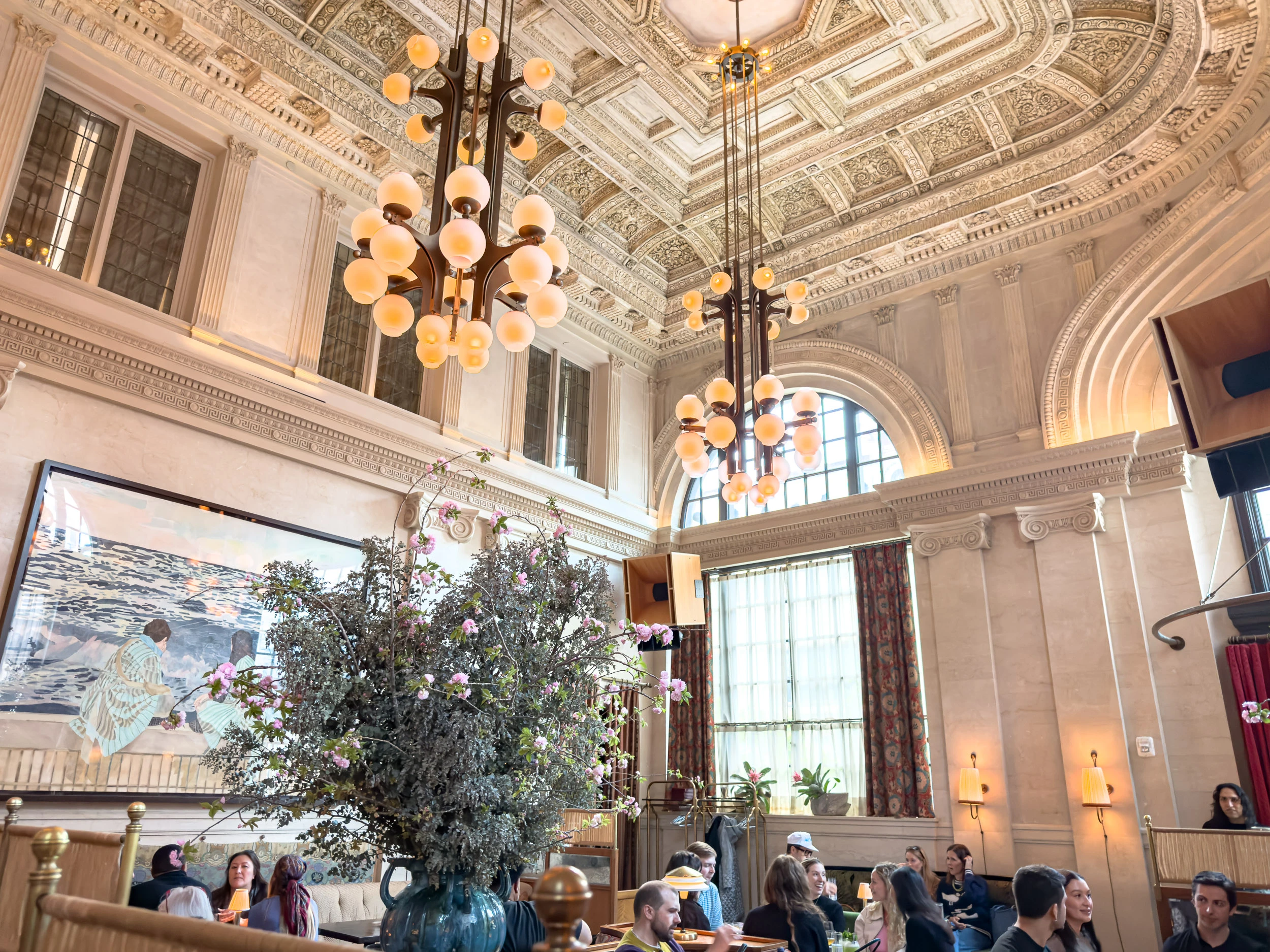 The vaulted ceiling and chandeliers of the Swan Room at Nine Orchard
