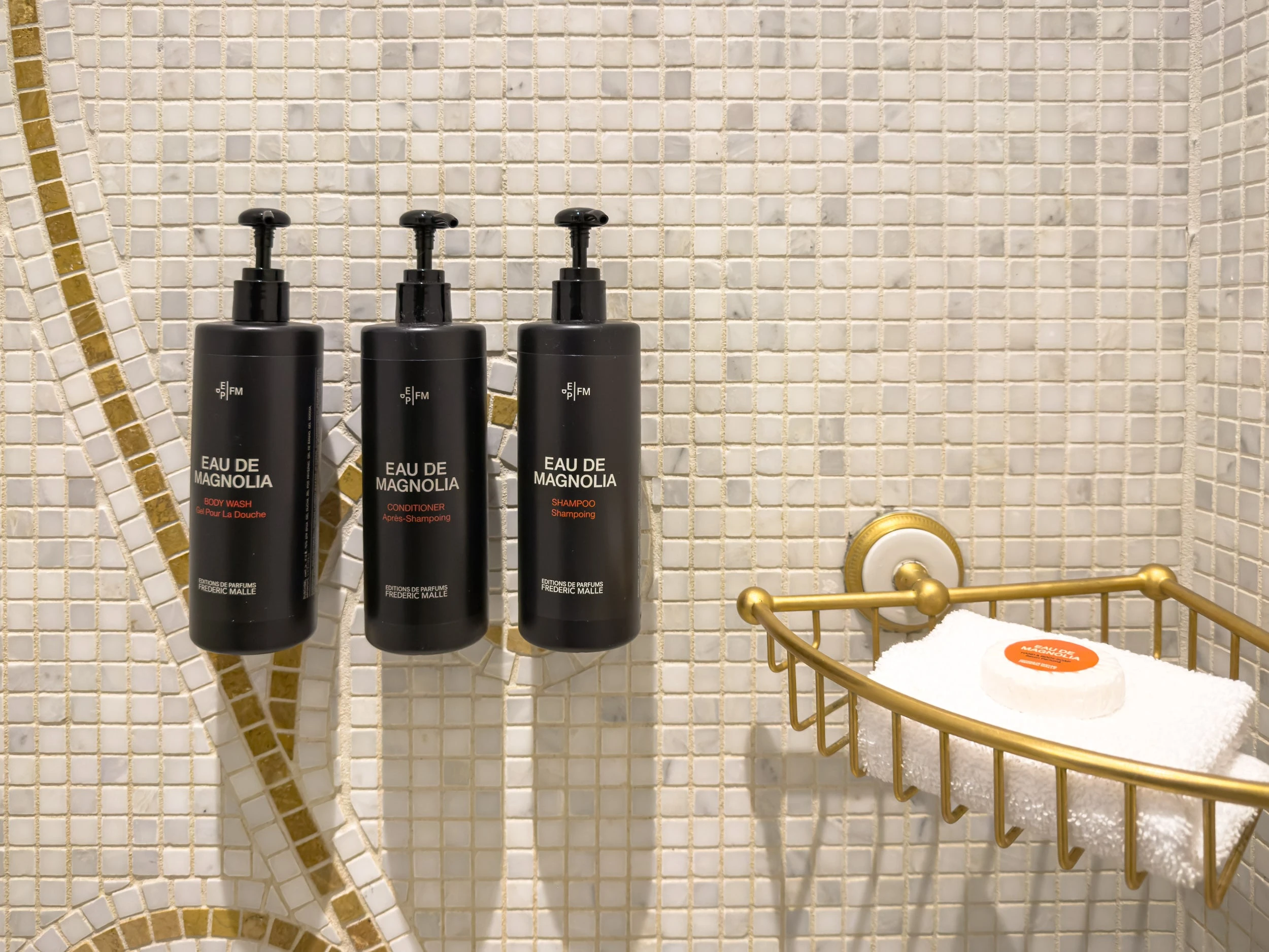 Shower with mosaic tile and Eau de Magnolia bath products at The Plaza Hotel New York