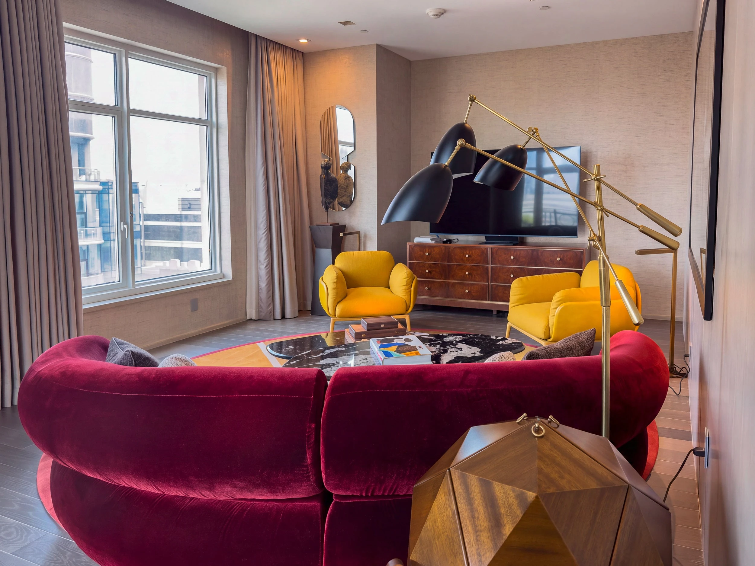 The living room with mid-century modern decor in the Tribeca Suite.