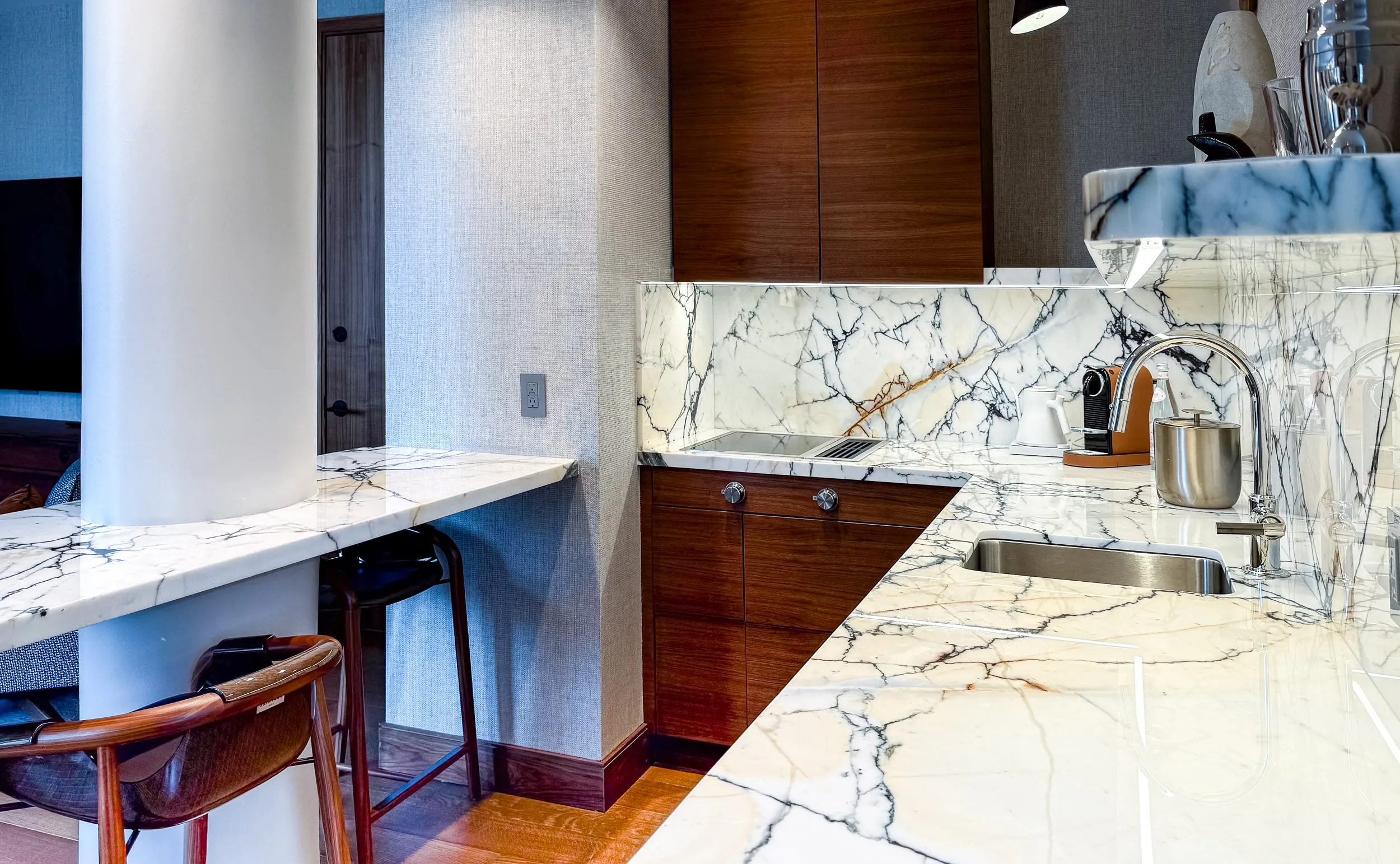 The Trinity Two-Bedroom Suite kitchen, with white marble.