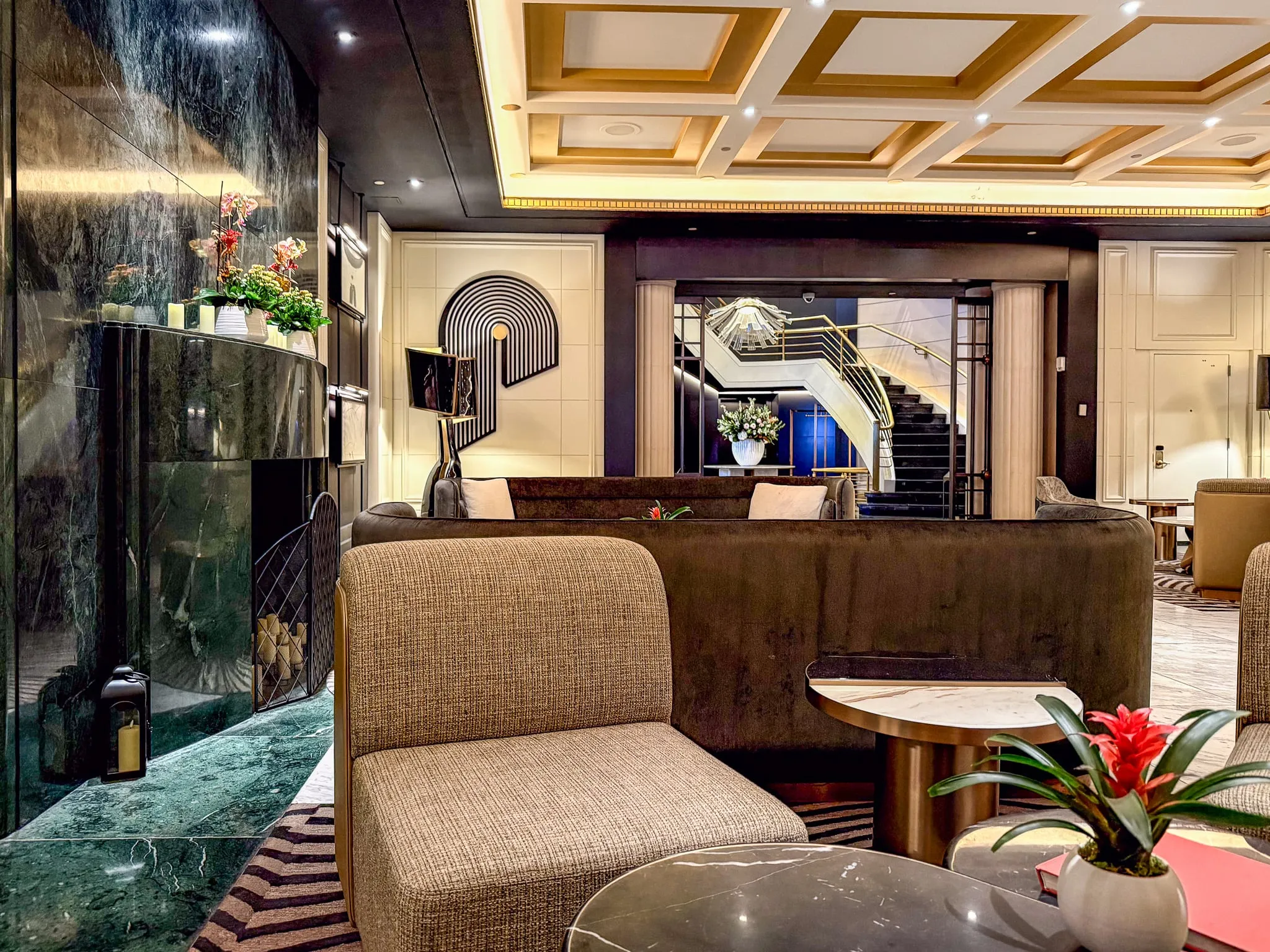 The large lobby seating area with sofas and chairs at Sofitel NYC.