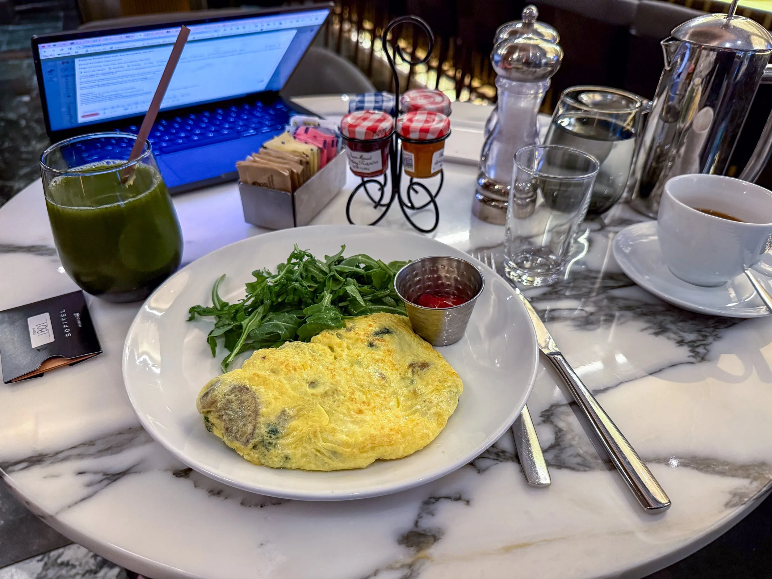 My breakfast omelette and salad on a white plate at Social 45.