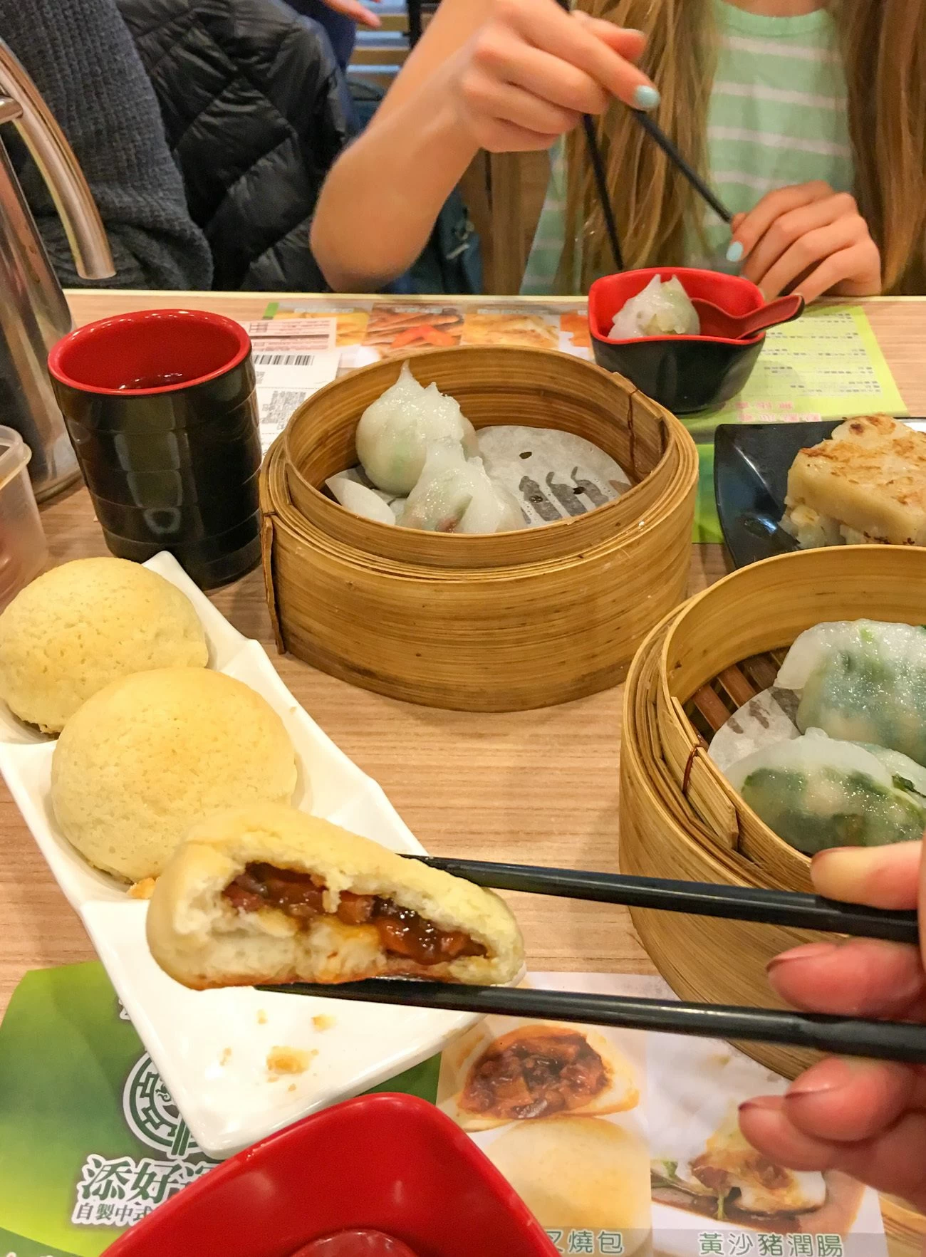 A bite taken out of a baked barbecue pork dumpling at Tim Ho Wan in Hong Kong