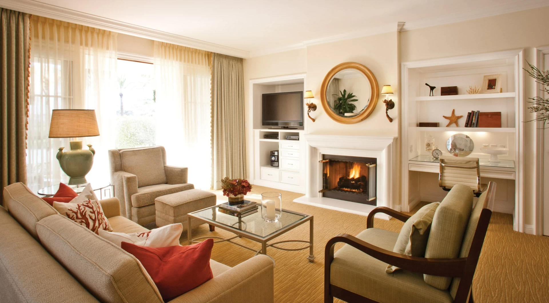 A spacious living room with a fireplace at Four Seasons San Diego.