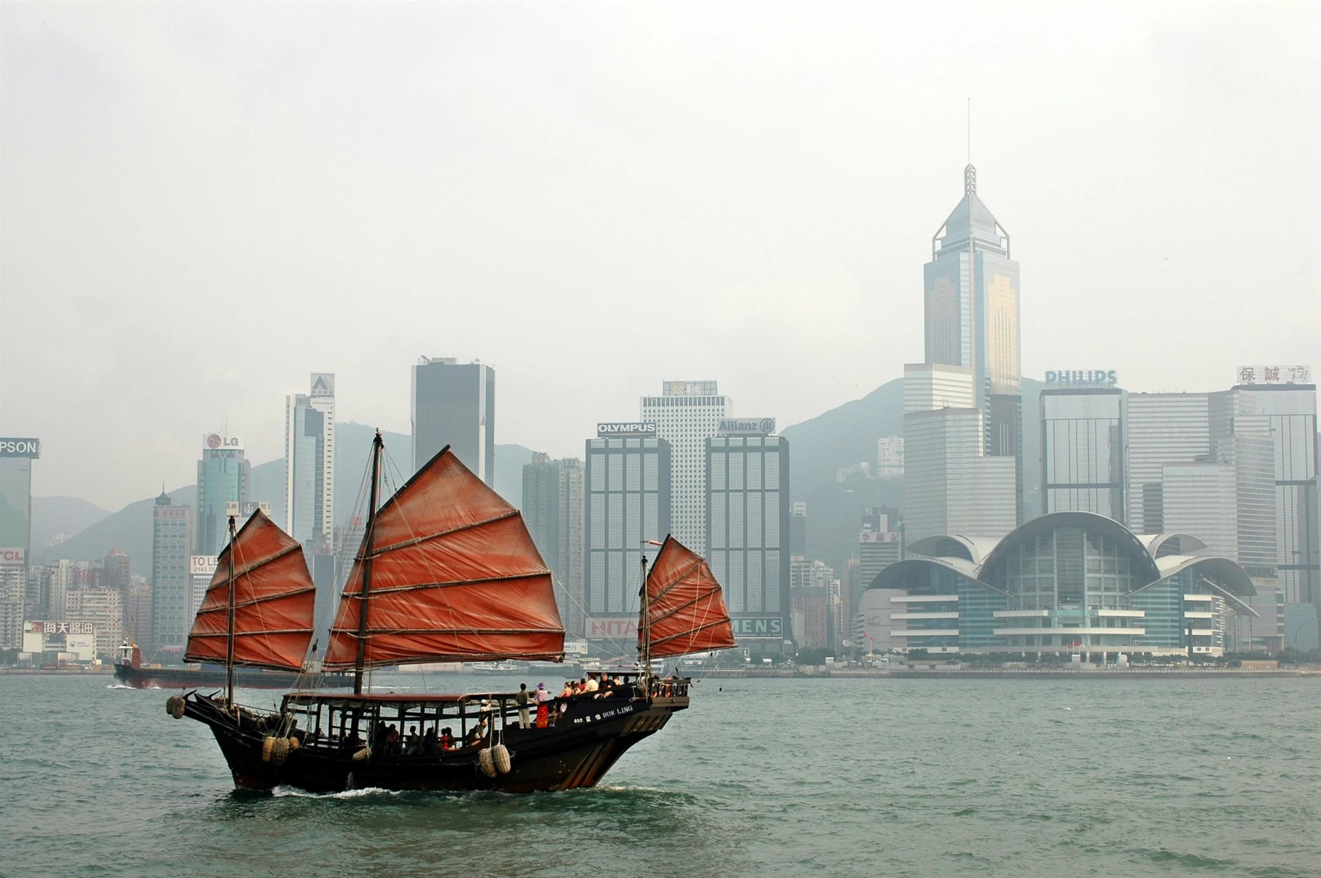 An iconic red-sailed junk boat in Victoria Harbour