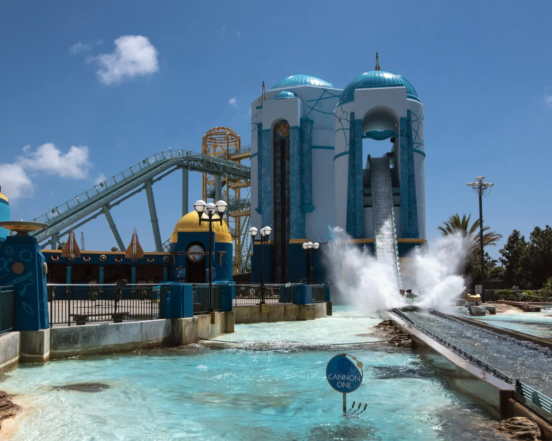 A boat splashes as hit hurls down the track on Journey to Atlantis, one of the most popular SeaWorld San Diego rides.