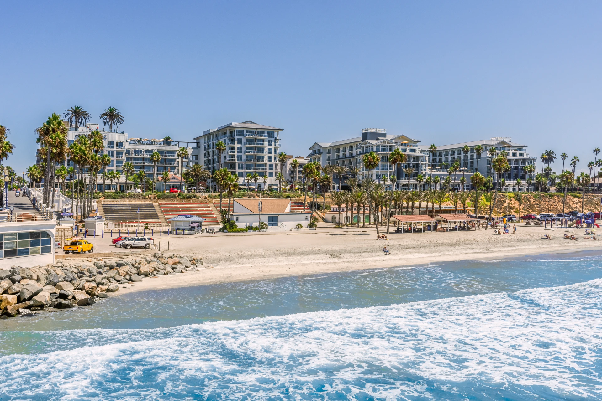 View from the water showing the two Hyatt Oceanside hotels across the street from the beach.